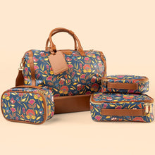  Set of floral-patterned luggage including a duffel bag, suitcase, and toiletry bag on a beige background.
